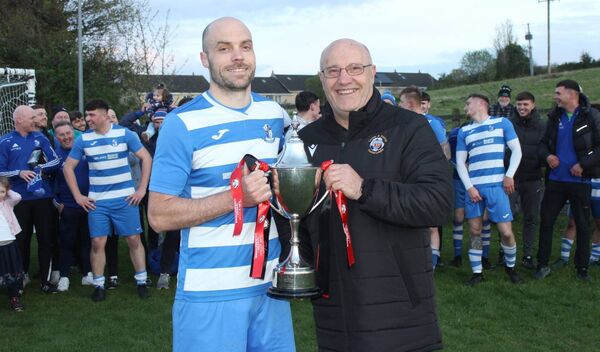 St Fiacc's captain Bobby Dowling receives the Tully Travel Division 1 trophy St Fiacc's captain Bobby Dowling receives the Tully Travel Division 1 trophy