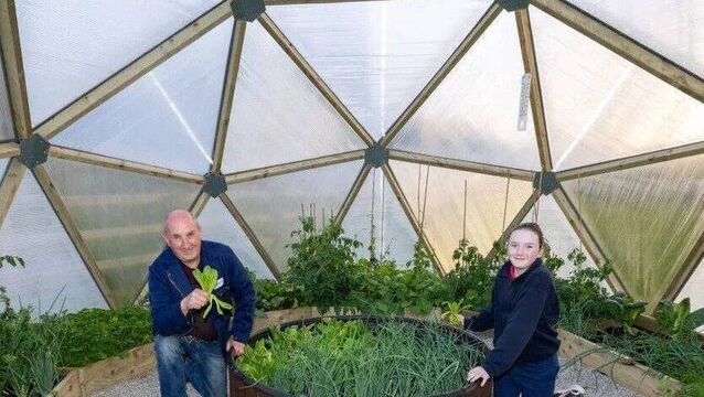 Noel Fennelly and Orlaith Headen pictured in 2025, with produce in the Knock Vintage Club Men's Shed Geodome. Photo: Alf Harvey <p>Noel Fennelly and Orlaith Headen pictured in 2025, with produce in the Knock Vintage Club Men's Shed Geodome. Photo: Alf Harvey</p>